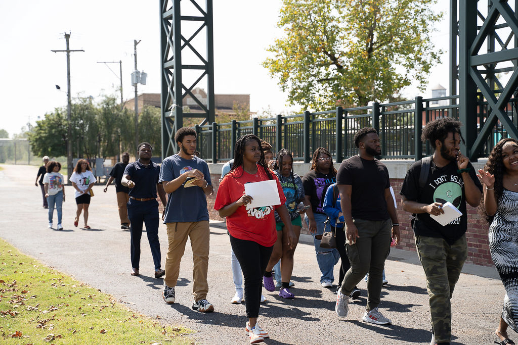 Fellows walking in Helena, Arkansas, on community tour, September 2023.